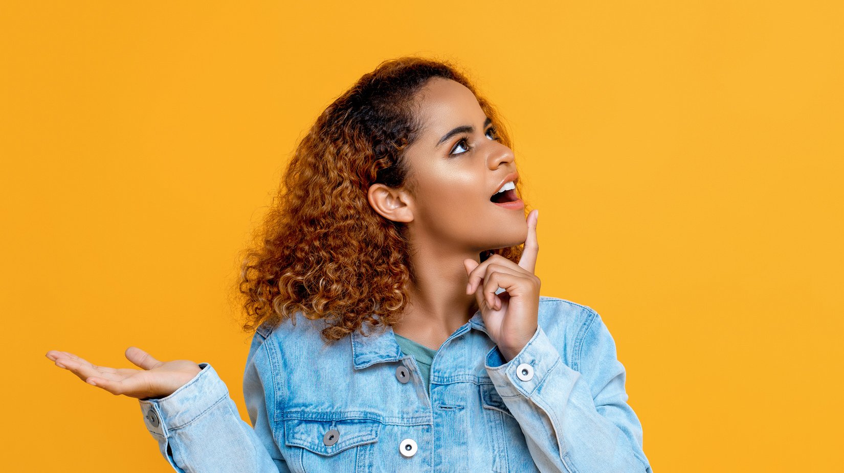 Woman thinking doing open palm gesture